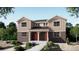 Charming two-story home featuring brick accents, a welcoming front porch, and beautifully landscaped surroundings at 24116 E 53Rd Dr, Aurora, CO 80019