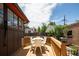 Cozy wooden deck with an outdoor table and chairs, perfect for entertaining at 1169 Cook St, Denver, CO 80206