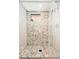 This bathroom features a tiled shower with stone accents and modern fixtures at 1169 Cook St, Denver, CO 80206