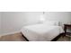 Bright bedroom features hardwood floors, a full size bed, and a sunny window at 1169 Cook St, Denver, CO 80206