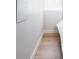 Bedroom detail featuring stylish hardwood floors, white baseboards, and white walls at 1169 Cook St, Denver, CO 80206