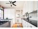 Kitchen with white cabinets and stainless steel appliances at 1169 Cook St, Denver, CO 80206