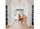 Cozy sitting area with a dormer window, desk, chair and access to 2 separate walk-in closets at 1169 Cook St, Denver, CO 80206