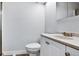 Clean, minimal bathroom with white vanity and toilet at 948 S Tennyson St, Denver, CO 80219