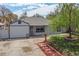 Charming one-story home featuring a well-maintained lawn and a unique pathway to the front door at 948 S Tennyson St, Denver, CO 80219