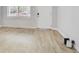 Bright living room featuring laminate floors and ample natural light at 948 S Tennyson St, Denver, CO 80219