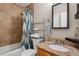 Bathroom featuring tiled walls and granite countertops at 2123 S Joplin Way, Aurora, CO 80013