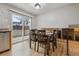 Cozy dining area with a view to the backyard, wooden table, and chairs at 2123 S Joplin Way, Aurora, CO 80013