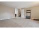 Spacious living room boasts neutral carpet and staircase at 2123 S Joplin Way, Aurora, CO 80013