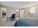 Spacious primary bedroom with a closet, bathroom, and desk setup at 2123 S Joplin Way, Aurora, CO 80013