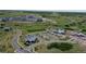 Aerial view of a neighborhood with community clubhouse, pool, parking, and surrounding green space at 1962 Canyonpoint Ln, Castle Pines, CO 80108