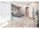 Cozy bedroom featuring neutral tones, carpeted floors, a gray upholstered bed, and ample closet space at 1962 Canyonpoint Ln, Castle Pines, CO 80108