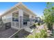 Charming home with a covered front porch, stone pillars, and landscaped front yard, offering curb appeal at 1962 Canyonpoint Ln, Castle Pines, CO 80108