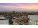 Stunning aerial view of the neighborhood with a beautiful sunset sky and mountain backdrop at 3036 Wilson Ct # 5, Denver, CO 80205
