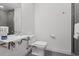 Cozy bathroom featuring floating sink, toilet, and tiled shower with sleek modern design at 3036 Wilson Ct # 5, Denver, CO 80205