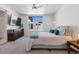 Serene bedroom featuring a ceiling fan, plush carpet, and large window at 3036 Wilson Ct # 5, Denver, CO 80205