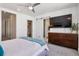 Comfortable bedroom with ensuite bathroom, a large window, and modern ceiling fan at 3036 Wilson Ct # 5, Denver, CO 80205