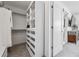 Bright walk-in closet featuring custom shelving and ample storage space for an organized wardrobe at 3036 Wilson Ct # 5, Denver, CO 80205