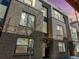Modern exterior elevation featuring large windows, brick, and professional landscaping at 3036 Wilson Ct # 5, Denver, CO 80205