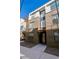 Close-up of a modern brick townhome featuring a large front door and contemporary design at 3036 Wilson Ct # 5, Denver, CO 80205