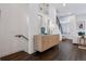 Bright hallway with stylish cabinet, decor, and dark hardwood flooring at 3036 Wilson Ct # 5, Denver, CO 80205
