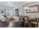 Open concept living room with a dining area and comfortable seating, offering lots of natural light at 3036 Wilson Ct # 5, Denver, CO 80205
