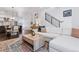 Cozy living room with modern furnishings, open floor plan, and staircase with black railing at 3036 Wilson Ct # 5, Denver, CO 80205
