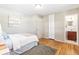 Light and airy bedroom with hardwood floors and en-suite bathroom at 1716 E Mineral Ave, Centennial, CO 80122