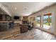 Finished basement features a stone fireplace, bar area, and walk-out access to the outdoors at 22025 Oehlmann Park Rd, Conifer, CO 80433