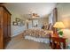 Comfortable bedroom featuring a ceiling fan, neutral walls, and decorative accents for a cozy retreat at 22025 Oehlmann Park Rd, Conifer, CO 80433