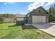 Charming home with a two-car garage and enclosed porch, set on a lush green lawn at 22025 Oehlmann Park Rd, Conifer, CO 80433