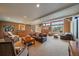 Spacious living room with ample natural light, multiple seating areas and great views of the forest at 22025 Oehlmann Park Rd, Conifer, CO 80433