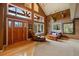 Inviting living room with high ceilings, large windows, and a cozy seating arrangement at 22025 Oehlmann Park Rd, Conifer, CO 80433