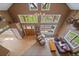 Bright living room with high ceilings, many windows, wood beams, and stylish decor at 22025 Oehlmann Park Rd, Conifer, CO 80433
