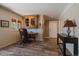 Office with natural light, built-in cabinet, desk, and tile floors at 22025 Oehlmann Park Rd, Conifer, CO 80433