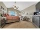 Main bedroom with vaulted ceiling, large windows, and sitting area at 3582 S Lisbon St, Aurora, CO 80013