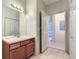 Bathroom with double vanity and access to linen closet at 8200 E 8Th Ave # 2102, Denver, CO 80230