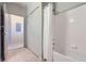 Clean bathroom with tub shower combo and tile flooring at 8200 E 8Th Ave # 2102, Denver, CO 80230