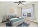 Bright bedroom with large window, ceiling fan, and plush carpeting at 8200 E 8Th Ave # 2102, Denver, CO 80230