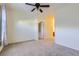 Well-lit bedroom featuring ceiling fan and carpet flooring at 8200 E 8Th Ave # 2102, Denver, CO 80230