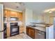 Kitchen boasts stainless steel appliances and wood cabinets at 8200 E 8Th Ave # 2102, Denver, CO 80230