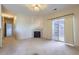 Living room featuring a fireplace and sliding glass doors at 8200 E 8Th Ave # 2102, Denver, CO 80230