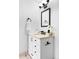 Bright bathroom with a modern vanity, framed mirror, and elegant decor at 1625 Larimer St # 1806, Denver, CO 80202