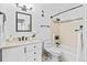 Well-lit bathroom with a modern vanity, tiled shower, and sleek fixtures at 1625 Larimer St # 1806, Denver, CO 80202