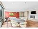 Spacious common room with fireplace, TV, dining area and city views at 1625 Larimer St # 1806, Denver, CO 80202