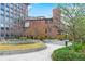 Peaceful courtyard with winding walkways, green spaces, and attractive architectural details at 1625 Larimer St # 1806, Denver, CO 80202