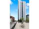 Stylish high-rise with seating area and trees for relaxing and enjoying city views from the deck at 1625 Larimer St # 1806, Denver, CO 80202