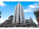 Exterior shot showcases a modern high-rise building with sleek lines and abundant windows at 1625 Larimer St # 1806, Denver, CO 80202
