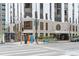 Street-level view of condo building featuring a walkway and decorative architectural details at entrance at 1625 Larimer St # 1806, Denver, CO 80202