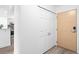Clean hallway with closet and entry door, accented by wood-look flooring and neutral tones at 1625 Larimer St # 1806, Denver, CO 80202